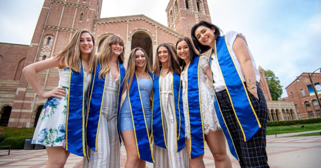 UCLA Students, Graduation, In front of UCLA building, Smiling, Close up, Sunny sky.